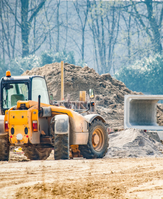 Digger moving rubble using the derv fuel supplied 